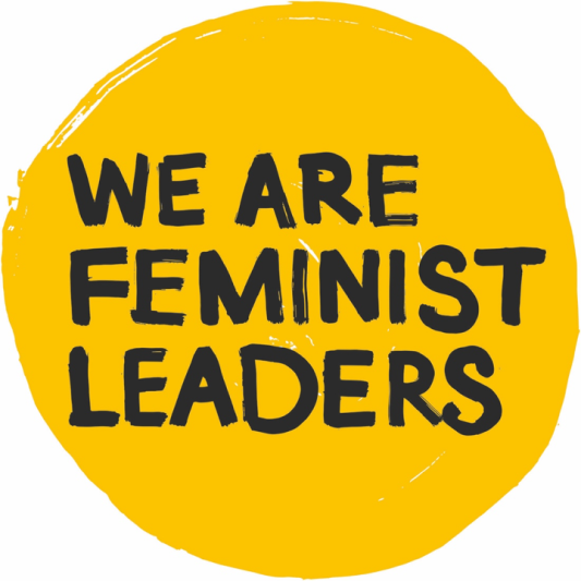 yellow circle with black letters "We are feminist leaders"