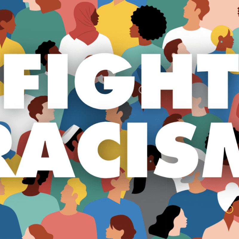 illustration of different colors of people with the words fight racism